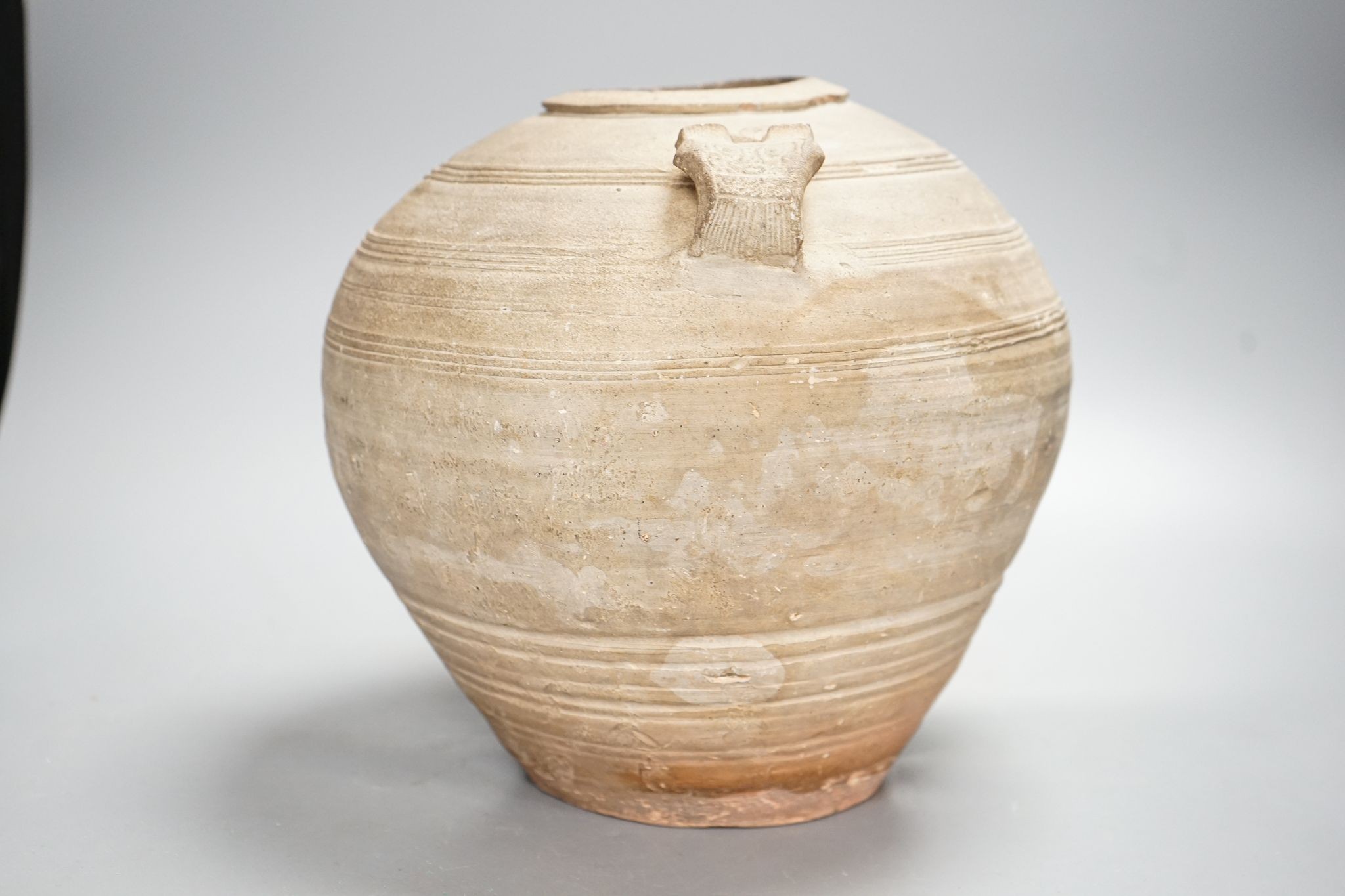 A Chinese Warring States pottery jar, 24cm